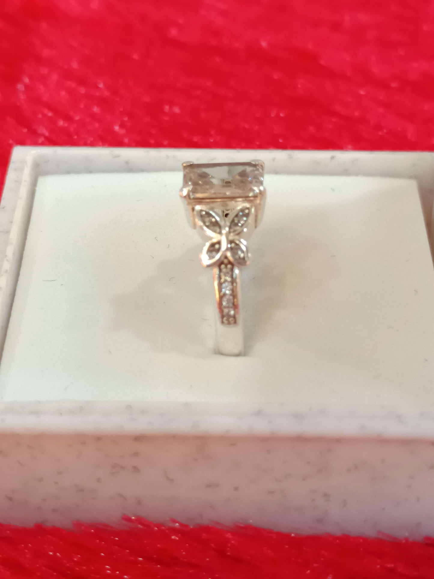 Elegant Butterfly Motif Silver Ring with Emerald-Cut Stone.