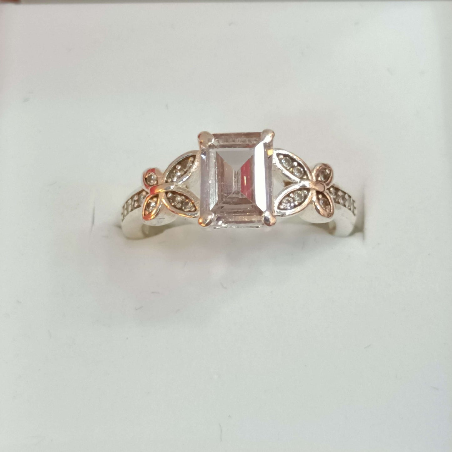 Elegant Butterfly Motif Silver Ring with Emerald-Cut Stone.