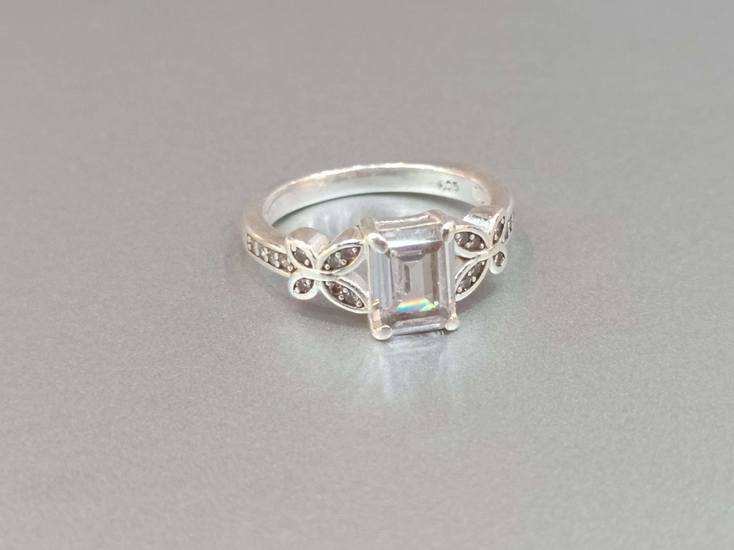 Elegant Butterfly Motif Silver Ring with Emerald-Cut Stone.