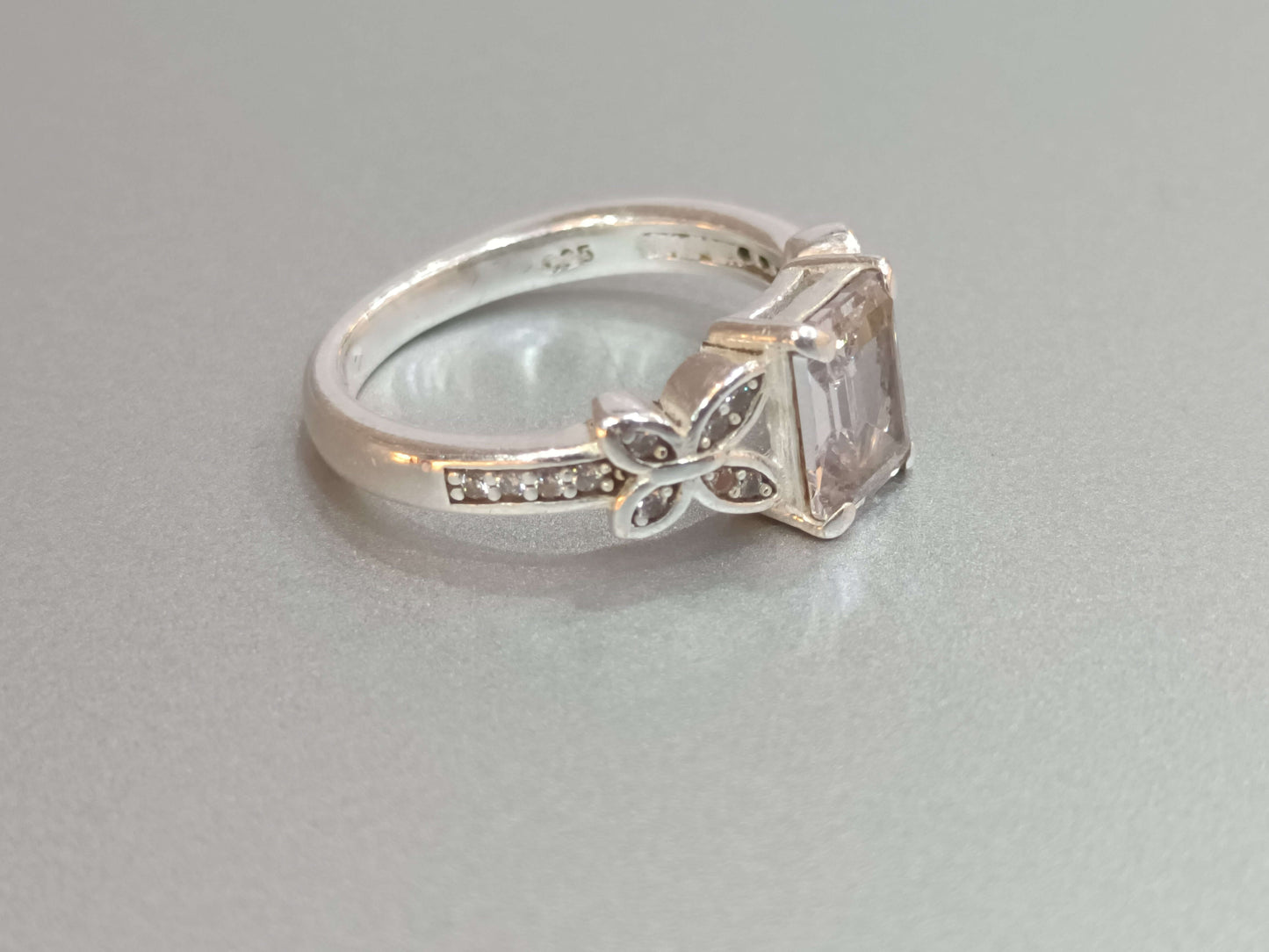 Elegant Butterfly Motif Silver Ring with Emerald-Cut Stone.