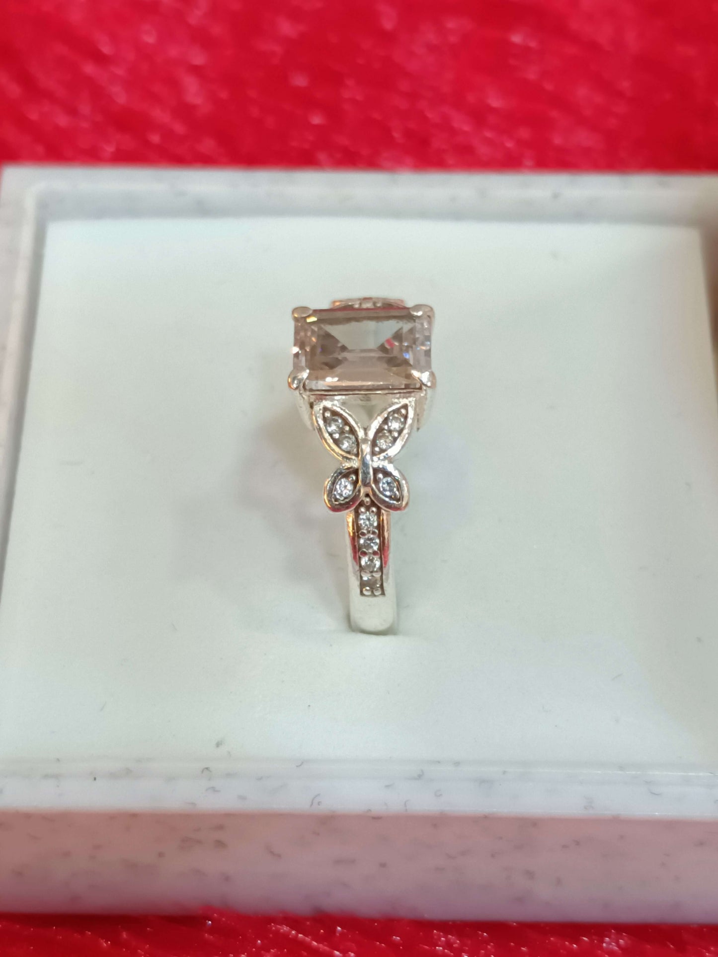 Elegant Butterfly Motif Silver Ring with Emerald-Cut Stone.