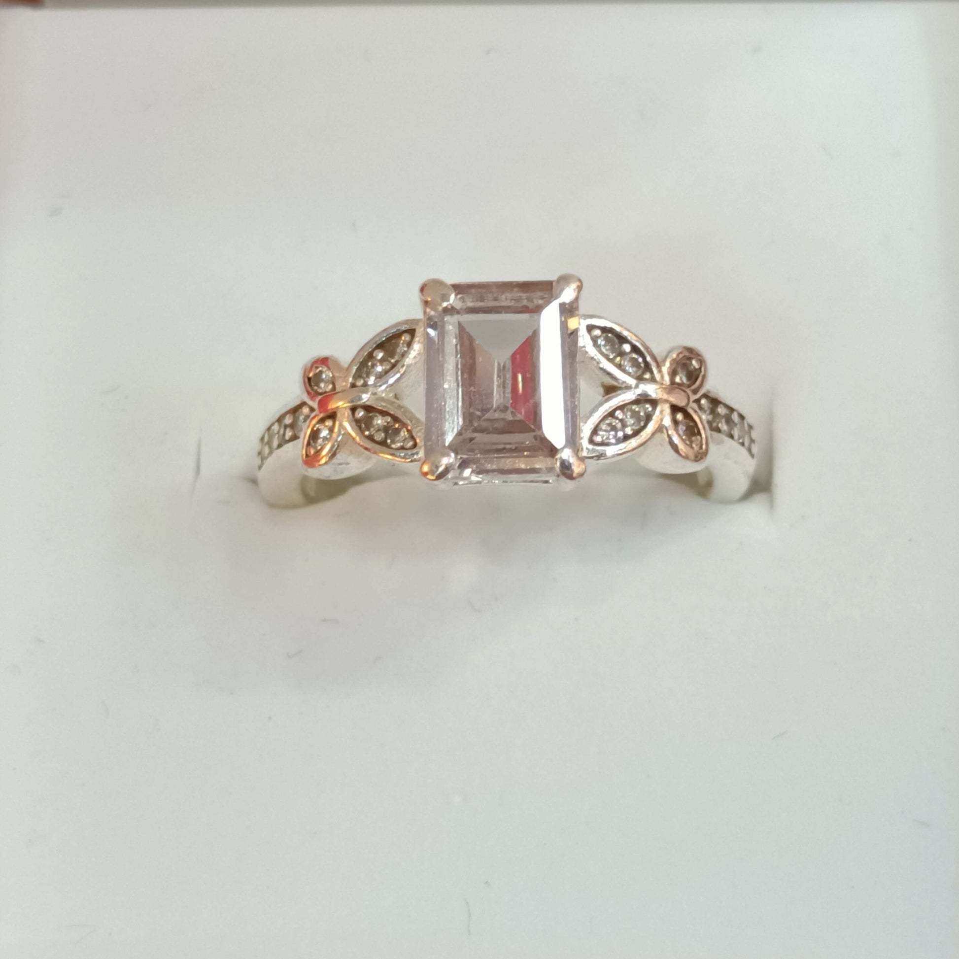 Elegant Butterfly Motif Silver Ring with Emerald-Cut Stone.